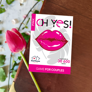 Flat lay product image highlighting design and colors of couples game box