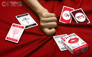 Oh Yes game for couples with cards on red blanket