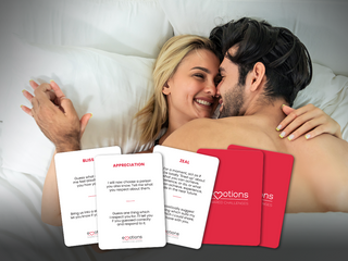 Couple embraces while playing Emotions Shared Challenges.