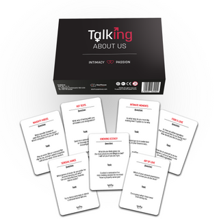 Organized laydown of couples intimacy game set including cards and box