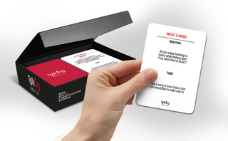 Close up of romantic question cards used in couples game